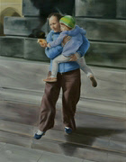 woman affectionately carries a child