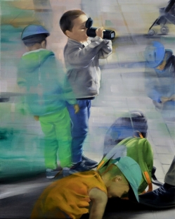 standing in upright position a boy drinks water to allay his thirst