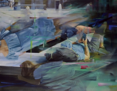 tourist lies down, reading messages from his mobile phone and corresponding with people he left